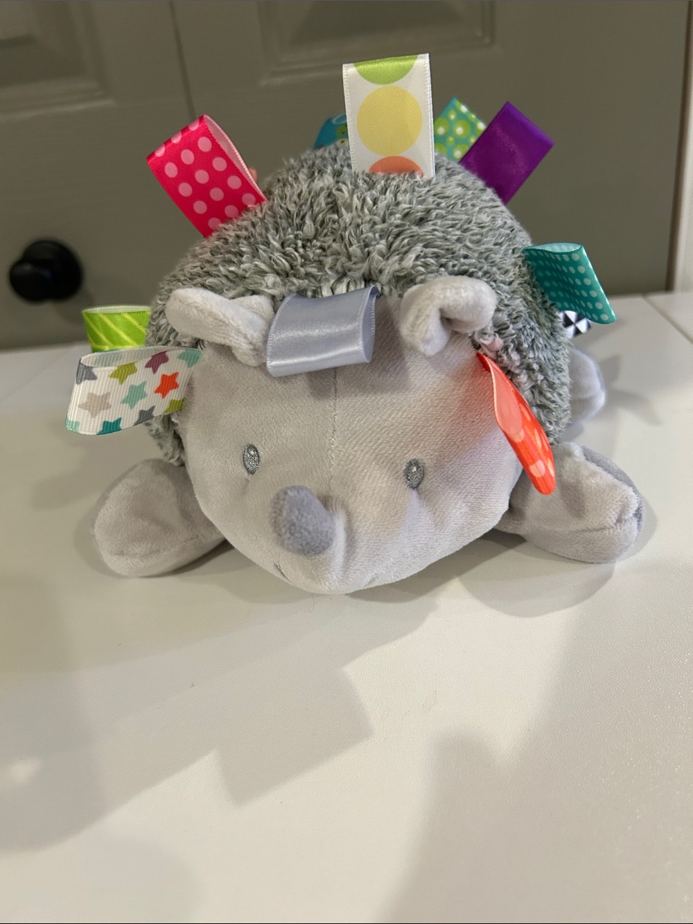 Taggies Gray Hedgehog Plush with Multicolored Ribbon Tags